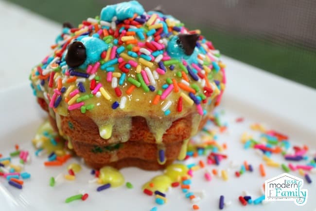 Close up of a cupcake decorated to look like a monster.