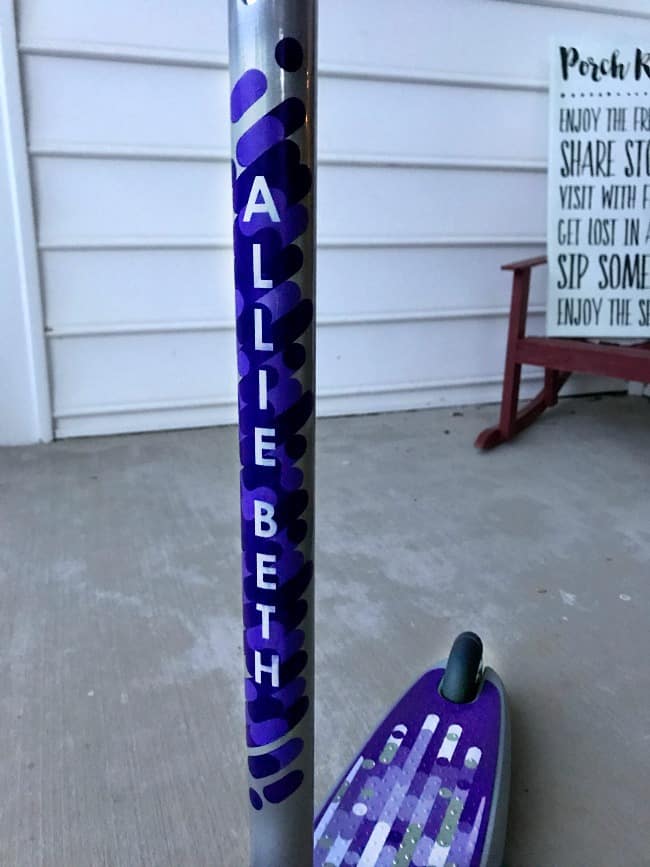 Close up of a purple Radio Flyer scooter.