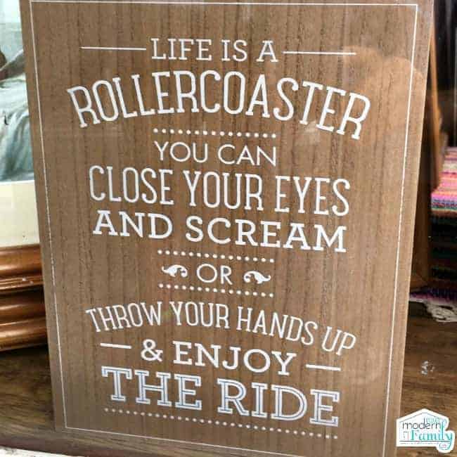 A wooden sign with text on it.