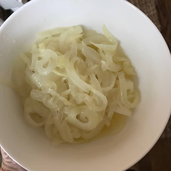 A bowl of sliced onions.