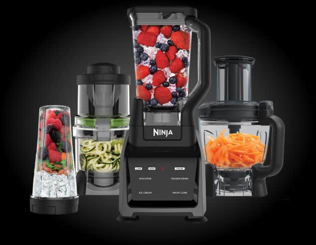 A Ninja Blender with it\'s attachments beside it.