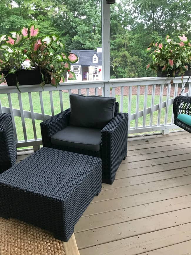 Close up of porch furniture and a porch swing.