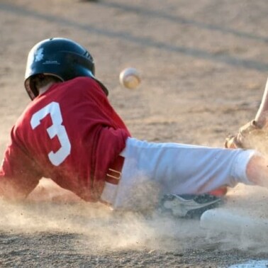 A baseball player sliding into a base.