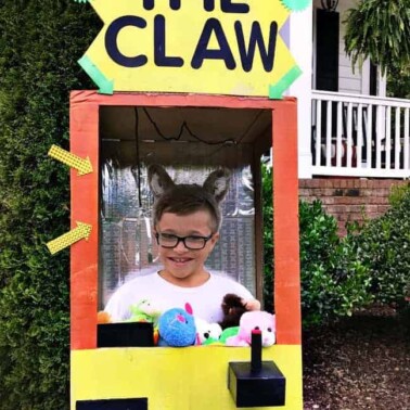 A boy dressed in a Claw game Halloween costume.