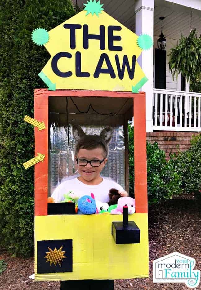 A boy dressed in a Claw game Halloween costume.