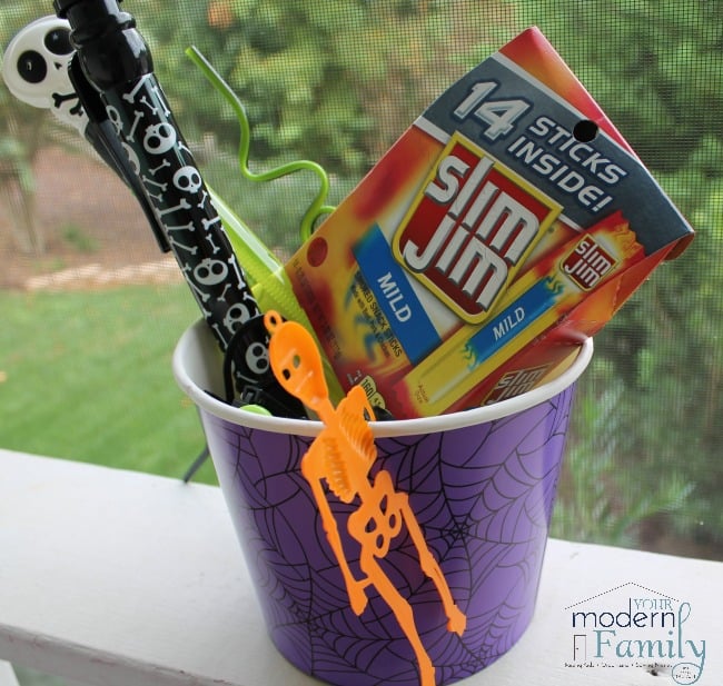 A Halloween bucket with Slim Jims and other treats.