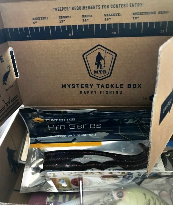 A box with fishing supplies in it.