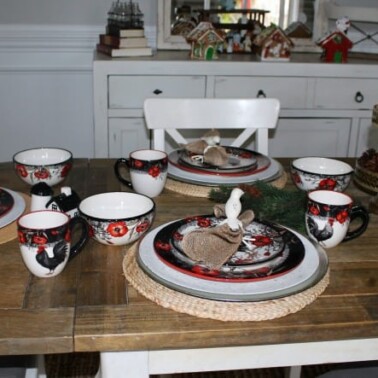 A kitchen with with plates and cup settings.