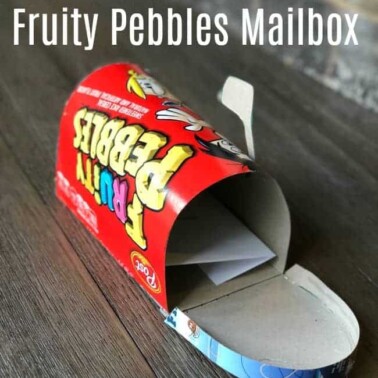 A mail box made out of a Fruity Pebbles cereal box.