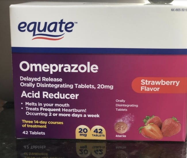 A close up of a box of equate brand of Omeprazole Acid Reducer.