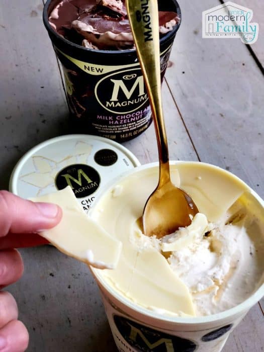 A close up of Magnum ice cream with a golden spoon in it.
