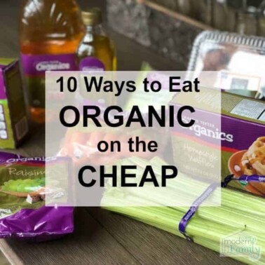 A variety of organic food on a table with text in front of them.