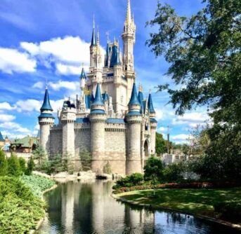 Cinderella's Castle with water in front of it.