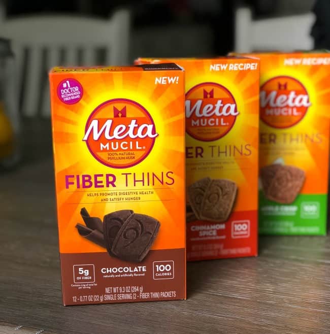 A variety of boxes of Meta Fiber Thins sitting on a table.