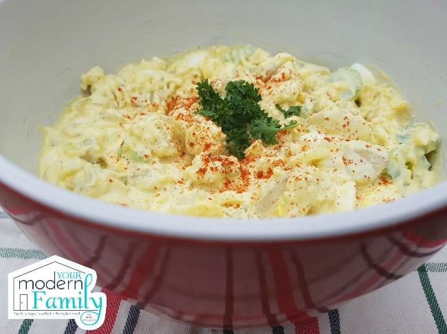 A bowl of food with rice and broccoli.