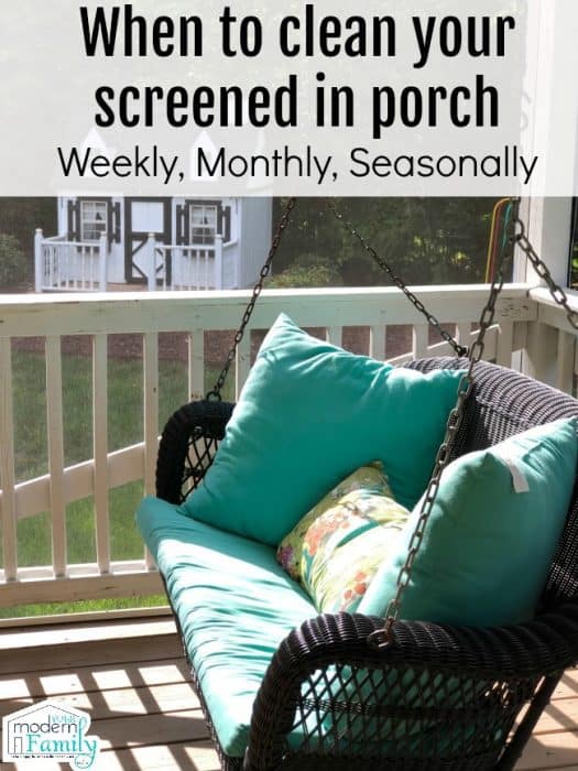 A porch swing on a screened in porch.