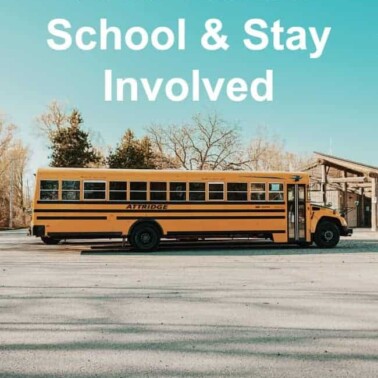 A school bus parked in a school parking lot with text above it.