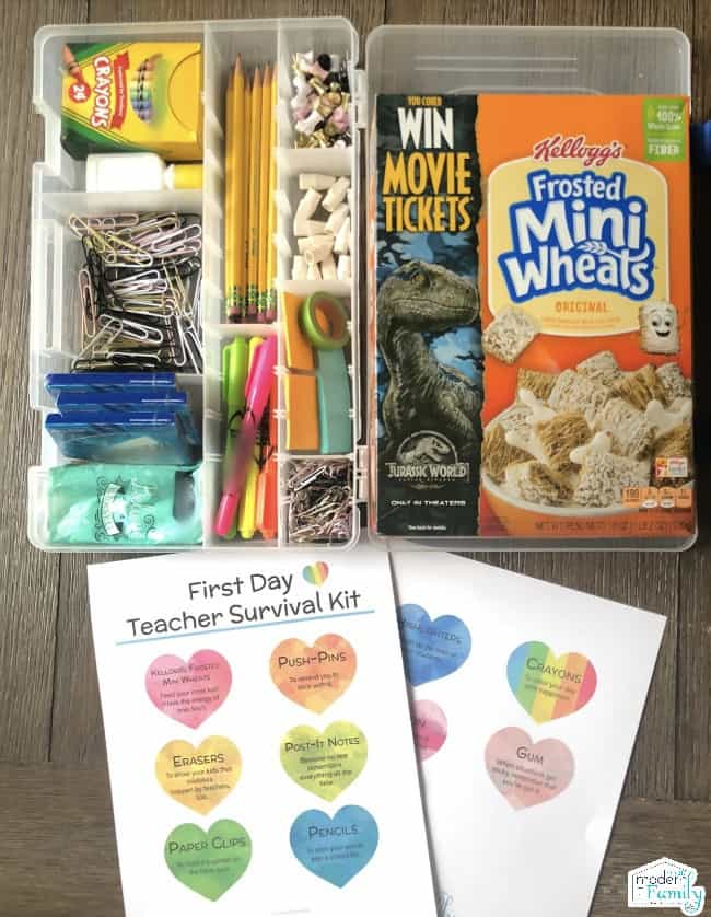 A variety of school supplies in plastic containers beside a box of Mini Wheats.