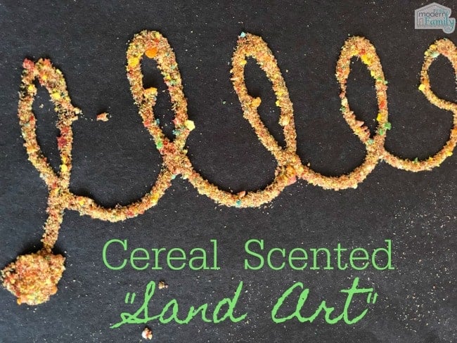 Crushed cereal shaped into a looped rope design on a black table with text under it.