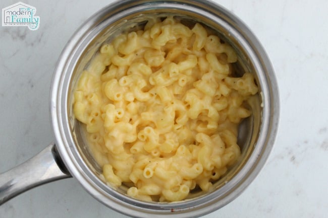  Macaroni and Cheese cooking in a metal pan.