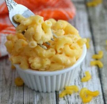 A close up of Macaroni and  Cheese in a small white bowl.
