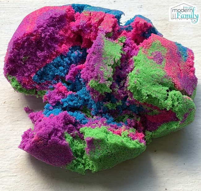A close up of mixed colors of Kinetic Sand.