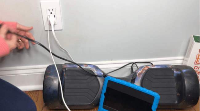 A hover board and a tablet being charged.