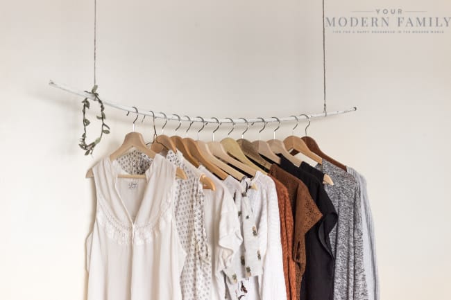 Clothes hanging on a rack.