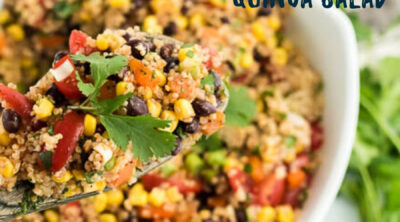 A bowl of food on a plate, with Quinoa and Salad