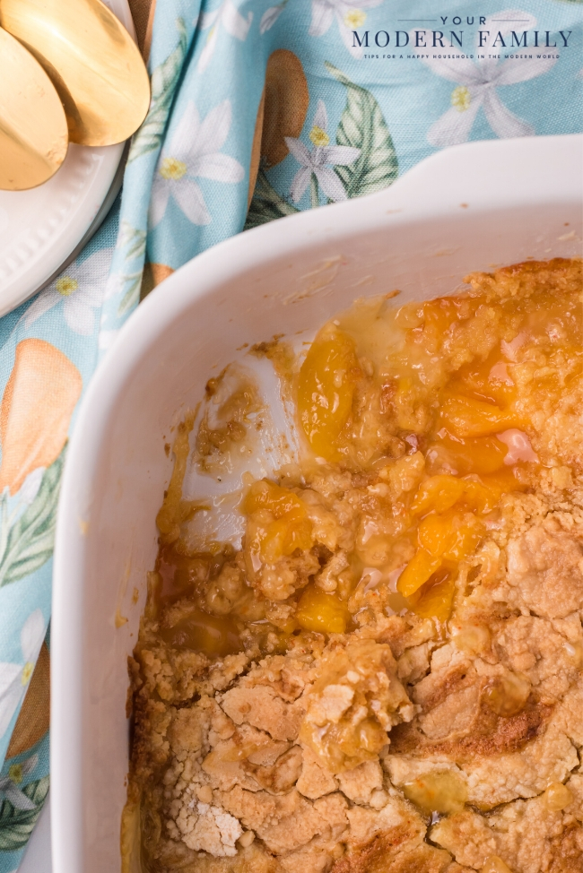 A bowl of food on a plate, with Cobbler and Peach