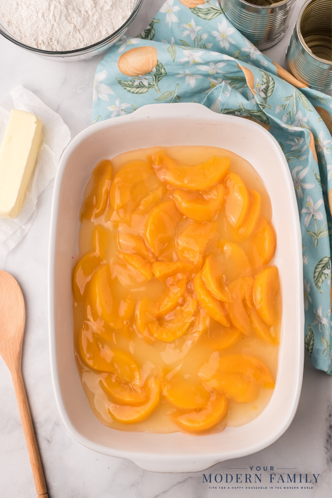 A bowl of food on a plate, with Cobbler and Peach