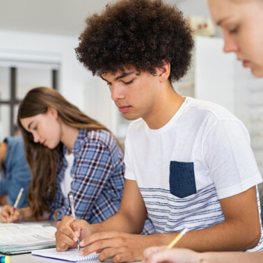 students writing in planner